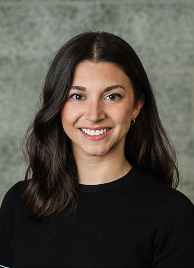 Clean and modern headshot of entrepreneur in outdoor setting, perfect for personal branding and company bios.