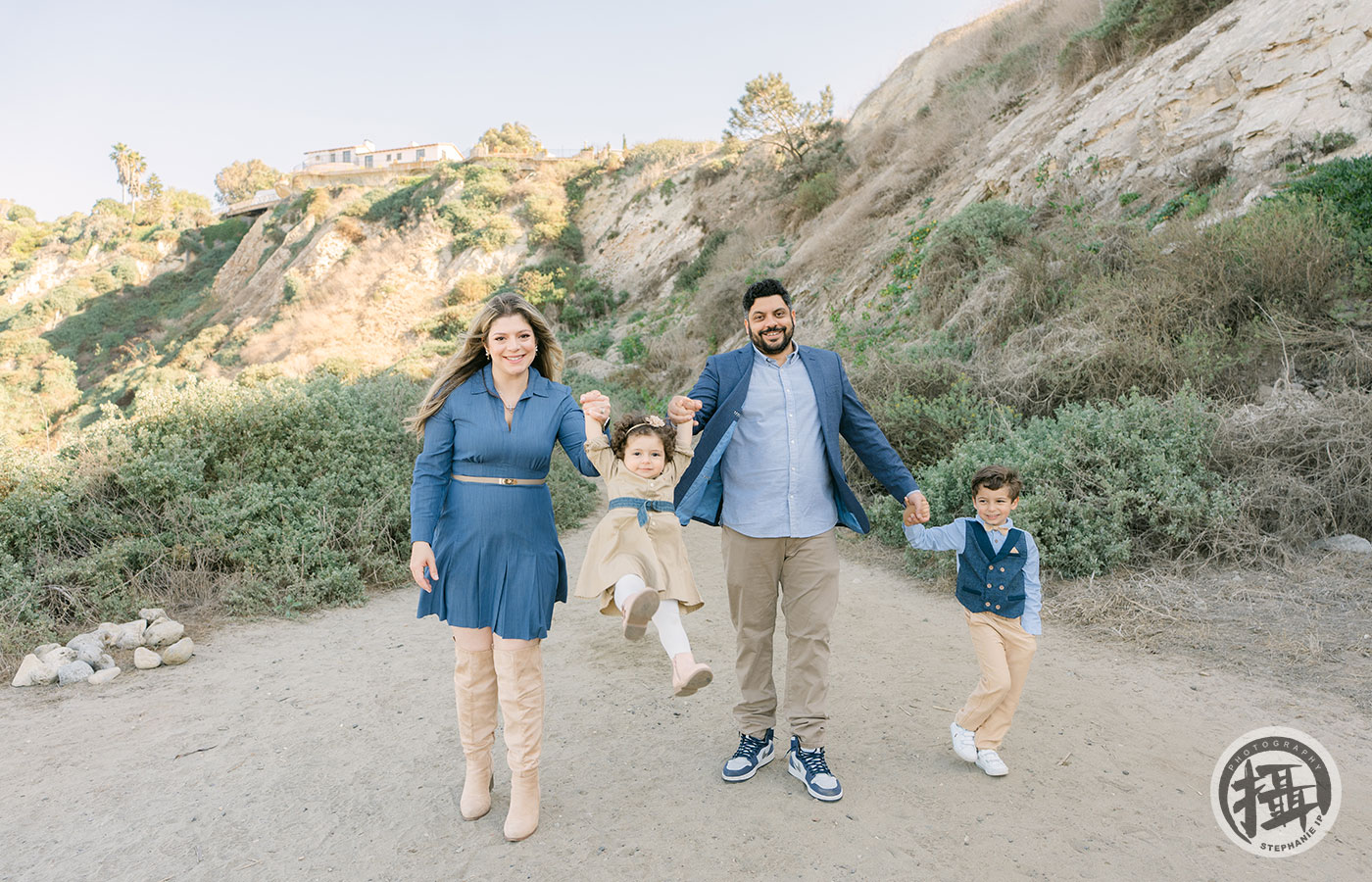 Extended family portraits at Newport Beach, captured with scenic ocean views by a leading Orange County family photographer.