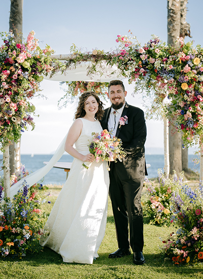 California's Best wedding photographer in Long Beach – a newlywed couple sharing a joyful moment at a stunning vineyard venue, beautifully captured by a top-rated Los Angeles wedding photographer.