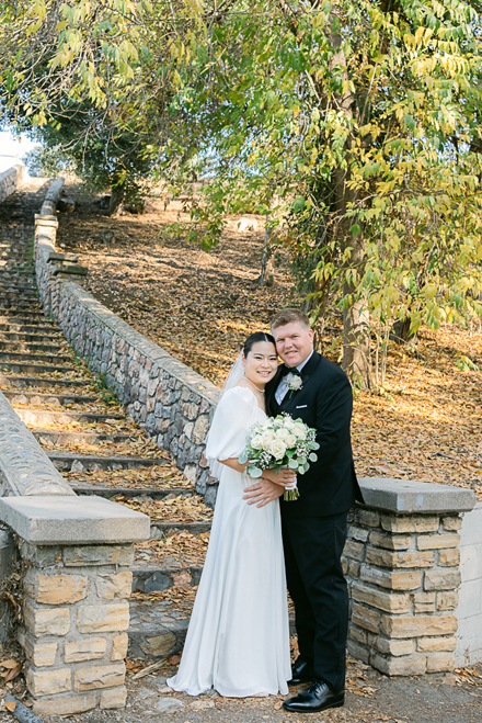 Timeless wedding photoshoot at Hillcrest Park in Fullerton, capturing the love and joy of a newlywed couple surrounded by scenic greenery by California’s best wedding photographer.