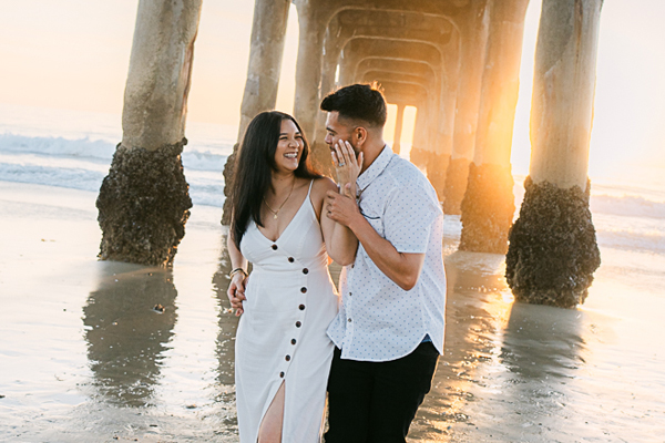 Romantic engagement photoshoot at Manhattan Beach, capturing the love and joy of a newly engaged couple with stunning ocean views by California’s best engagement photographer.