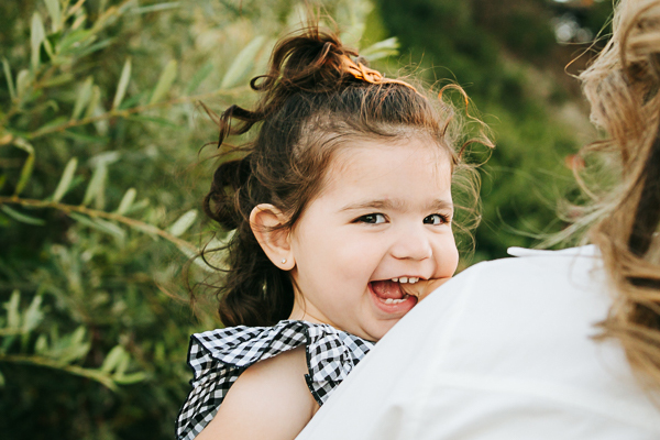 Heartwarming family photoshoot capturing the sweet smile of a little girl, preserving joyful moments with California’s best family photographer.