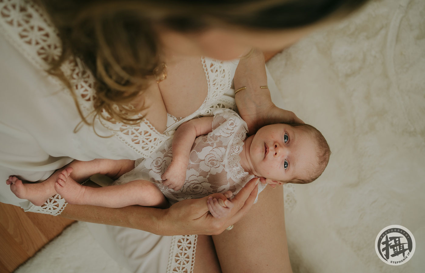 In-home lifestyle newborn session in Brentwood, highlighting intimate family moments with a modern, editorial approach.