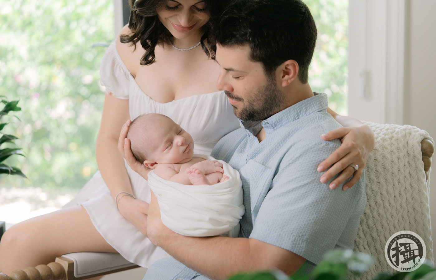 In-home newborn photography session in Palos Verdes, capturing tender moments with baby and parents by the best newborn photographer in Los Angeles.