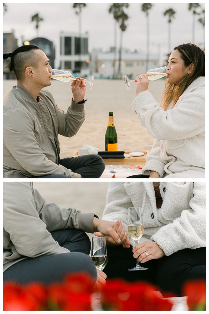 Romantic DIY beach proposal setup with red roses at Venice Beach, California.