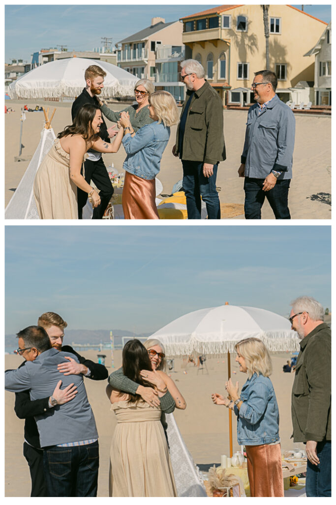 A couple embraces at their beach picnic proposal in Hermosa Beach, Los Angeles.