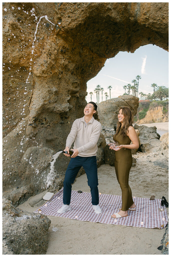 Romantic beach proposal at Treasure Island Beach Cave in Laguna Beach, California.