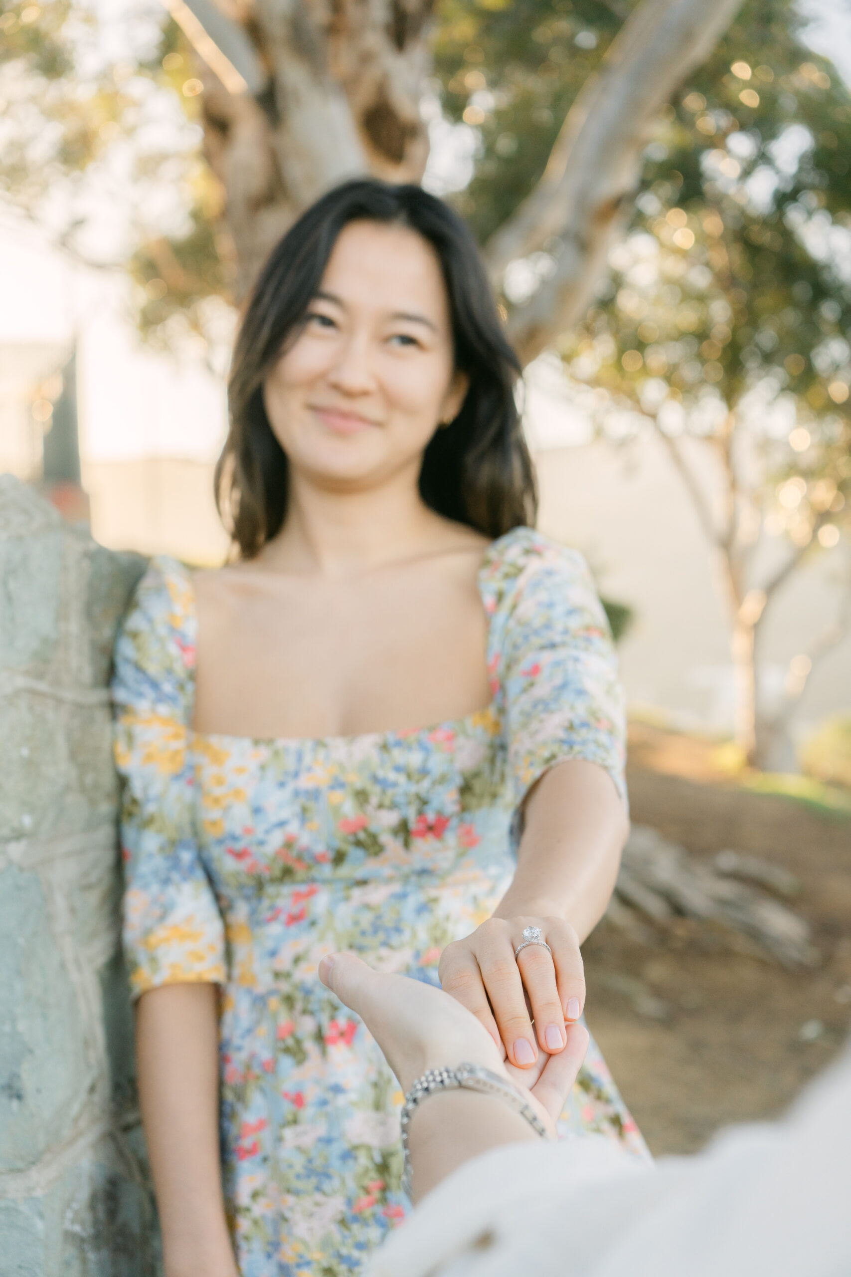 Surprise proposal on Catalina Island at sunset with champagne and ocean backdrop in Avalon