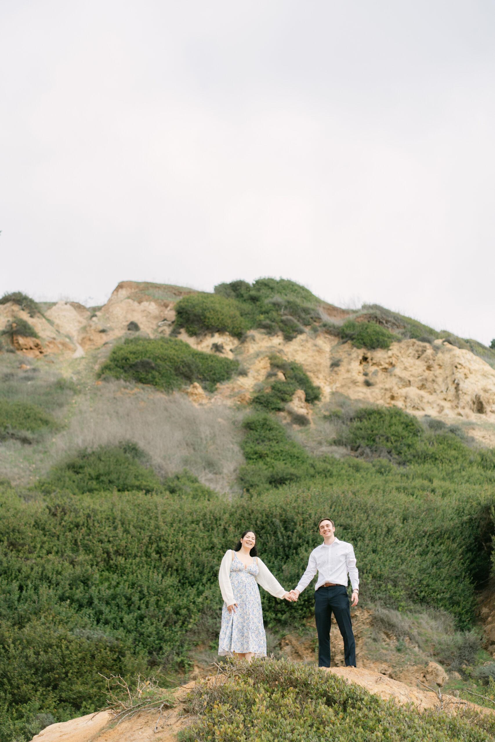 Kaitlyn and Jacob’s surprise engagement moment overlooking the ocean in Palos Verdes on an overcast spring afternoon