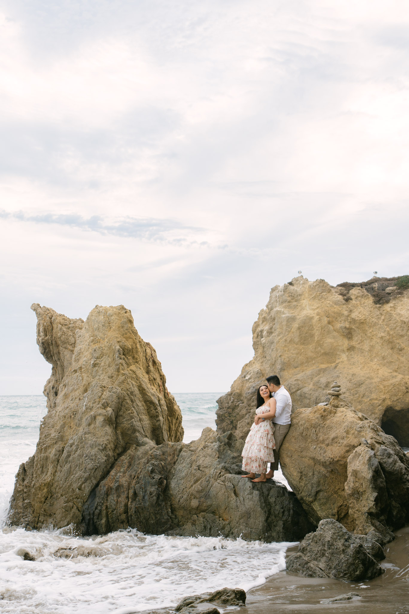Engagement photos at El Matador State Beach with ocean cliffs