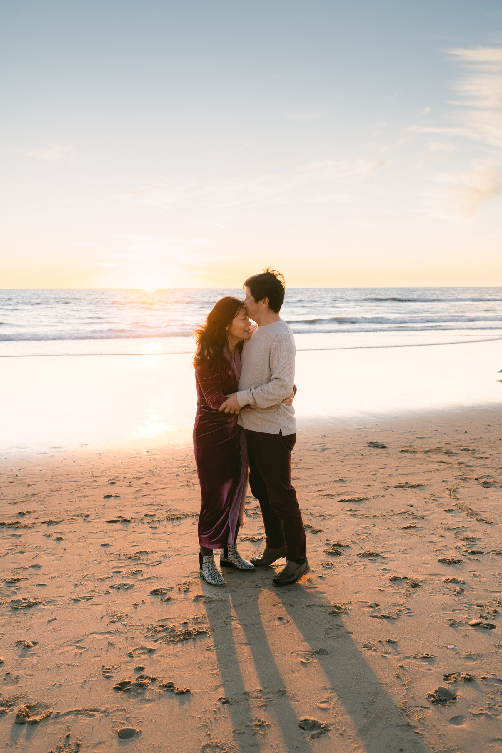 25th wedding anniversary photoshoot Manhattan Beach couple walking hand in hand