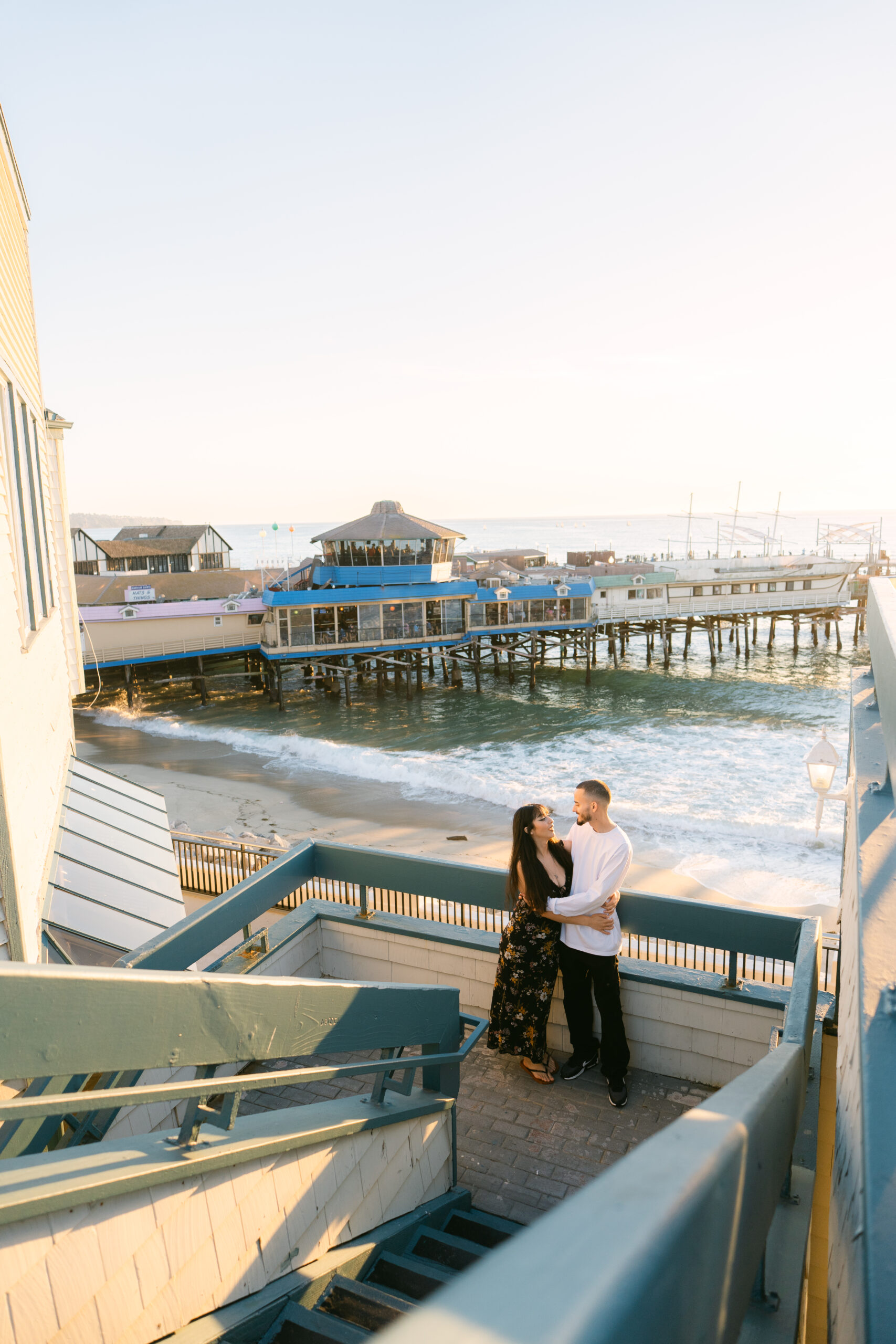 surprise proposal blindfold reveal with family member and dog at Redondo Beach