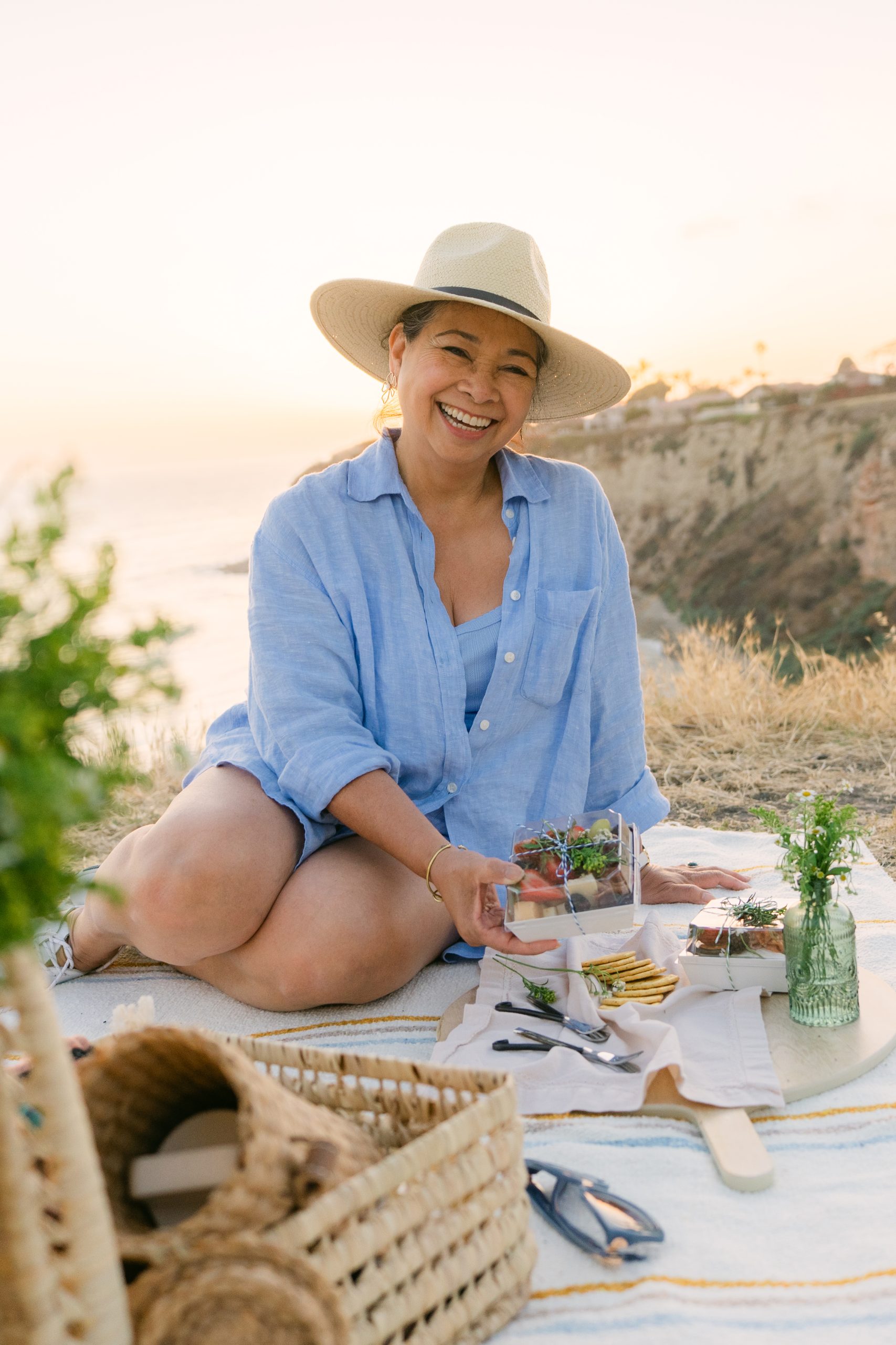 Meirose Marquez founder of Picnic with Me at curated picnic setup on Palos Verdes cliffside, lifestyle branding photography Stephanie Ip Photography Southern California